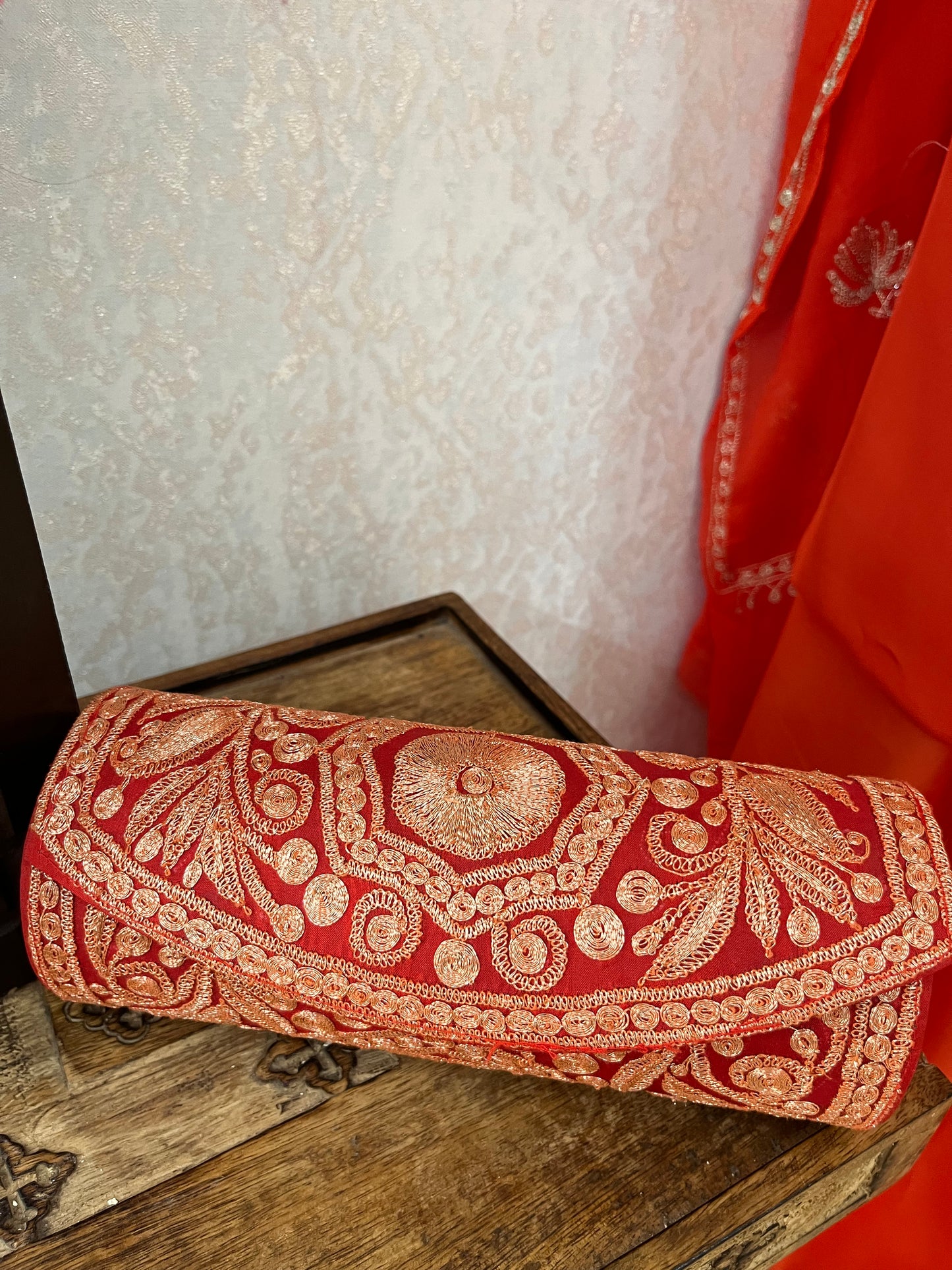 Orange Crape Kashmiri Suit with Clutch